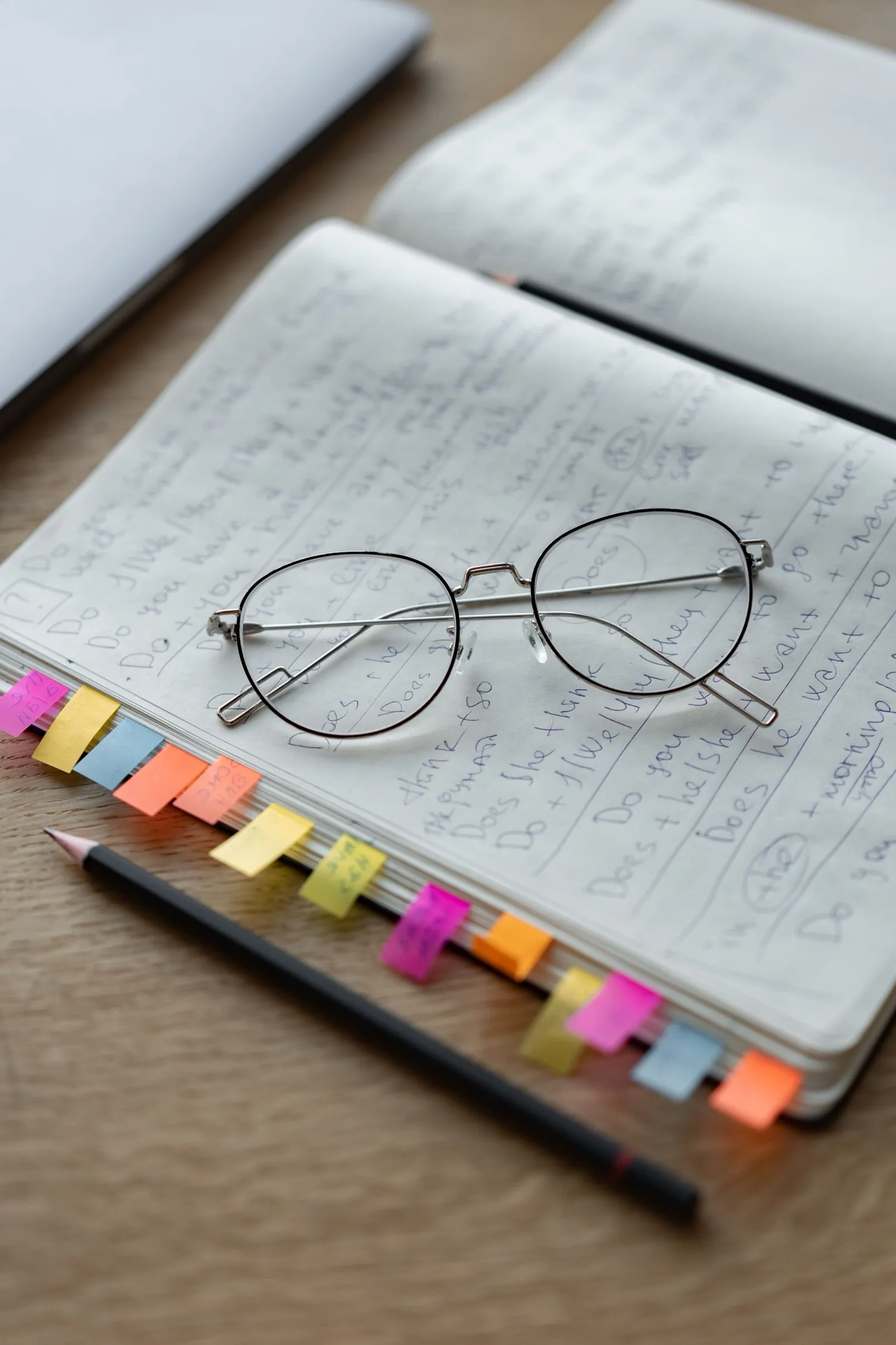 Handwritten meeting notes in a paper notebook