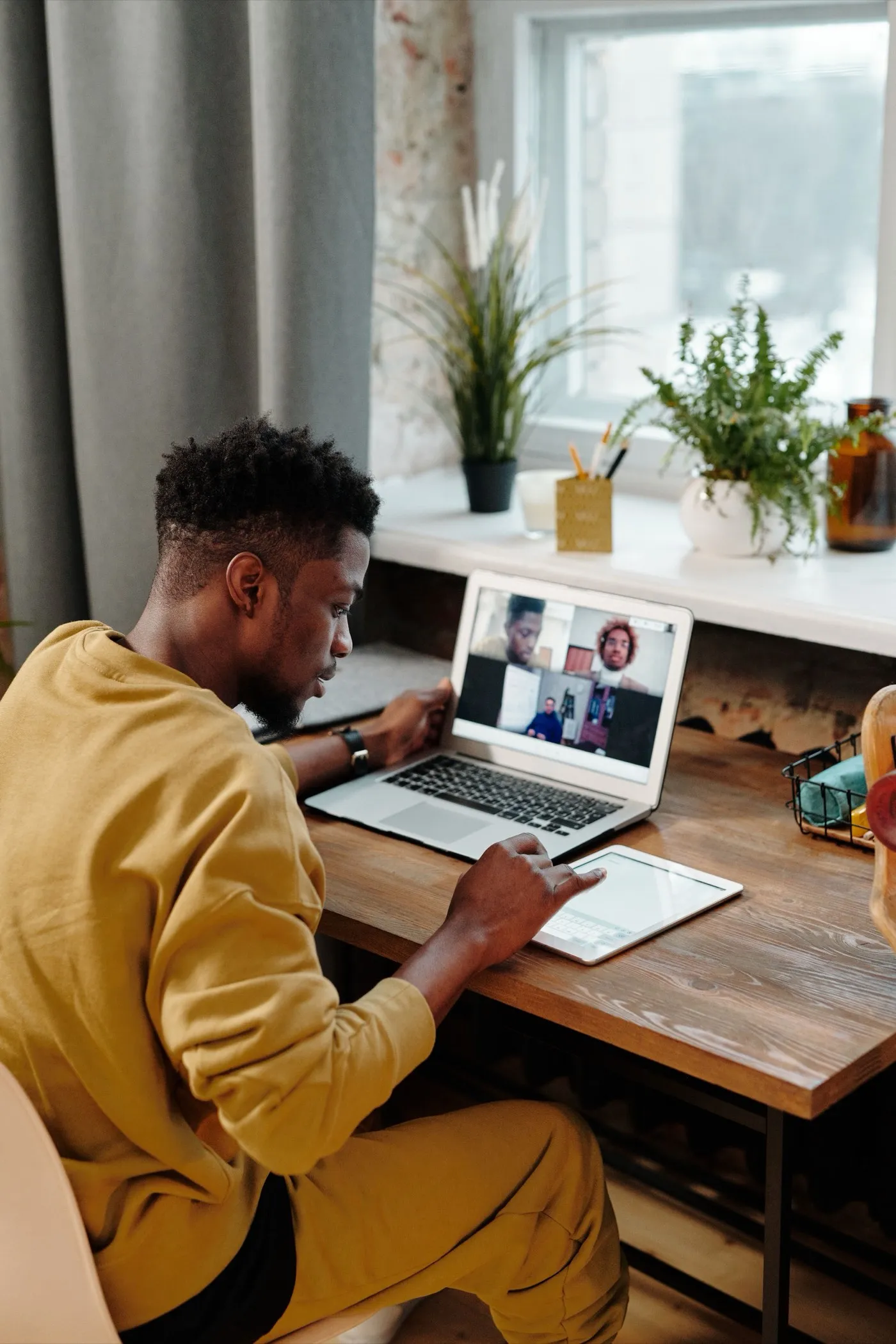 A team video call with a grid of smiling participants